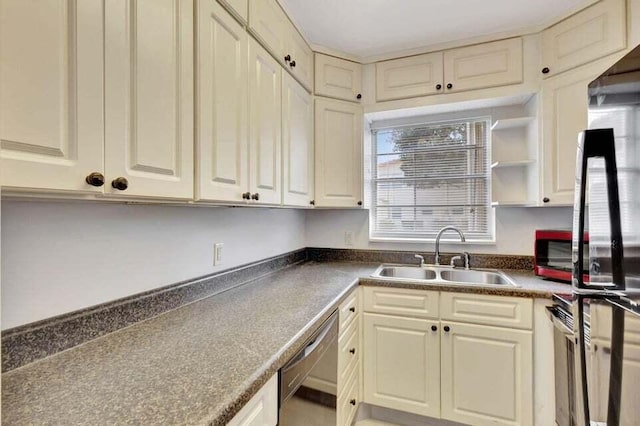 kitchen featuring cream cabinetry, stainless steel dishwasher, and sink