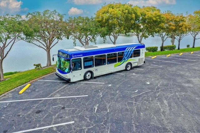 view of parking with a water view