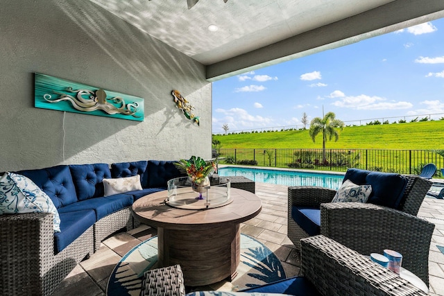 view of patio / terrace featuring outdoor lounge area and a fenced in pool