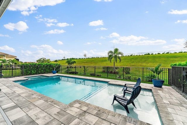 view of pool featuring a patio area and a rural view