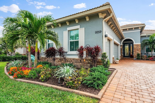 view of side of home with a garage