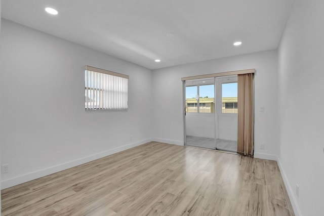 unfurnished room with light hardwood / wood-style flooring