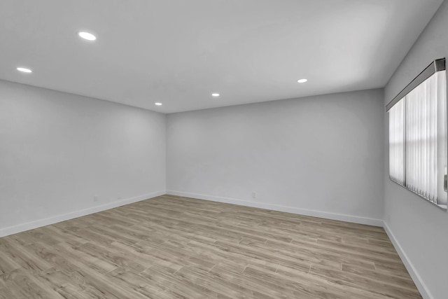 spare room featuring light wood-type flooring