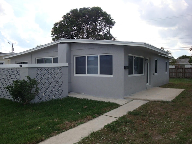 view of home's exterior featuring a lawn