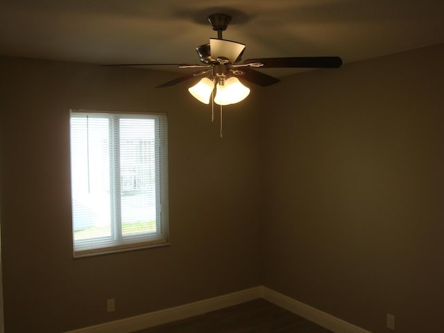 empty room with hardwood / wood-style flooring and ceiling fan