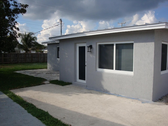 exterior space featuring a yard and a patio