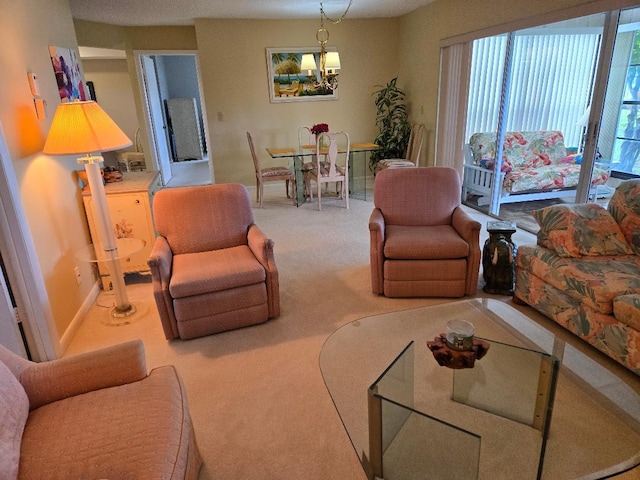 living room with carpet and an inviting chandelier