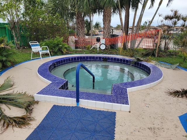 view of pool featuring a community hot tub