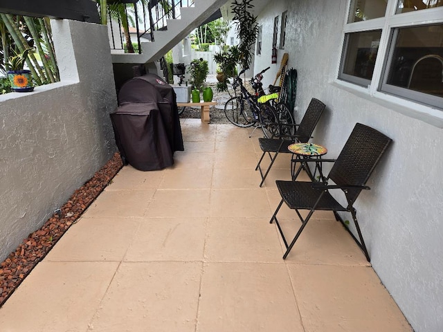 view of patio with a grill