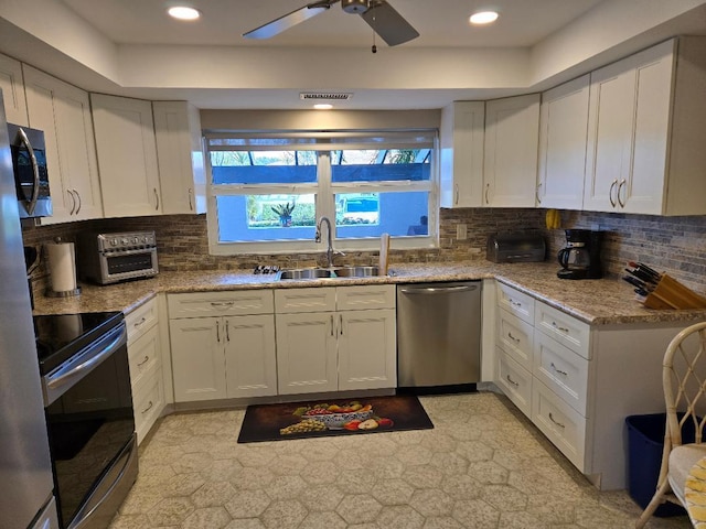 kitchen with black range with electric stovetop, light stone countertops, sink, tasteful backsplash, and stainless steel dishwasher