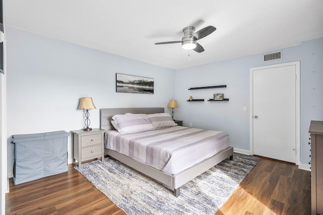 bedroom featuring dark hardwood / wood-style floors and ceiling fan