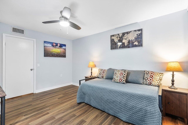 bedroom with dark hardwood / wood-style flooring and ceiling fan