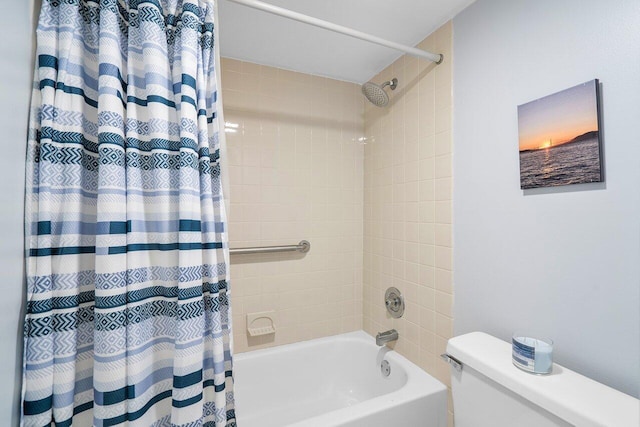 bathroom featuring shower / bath combination with curtain and toilet