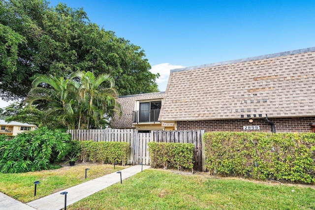 view of home's exterior featuring a lawn