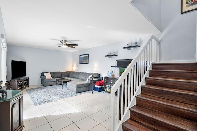 tiled living room with ceiling fan