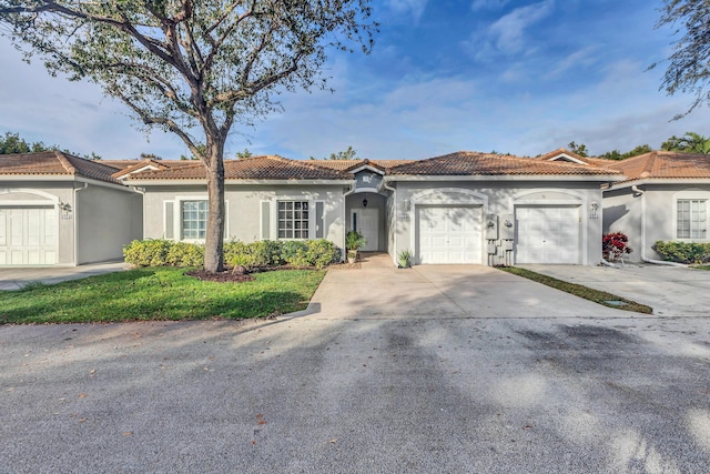 mediterranean / spanish house with a garage