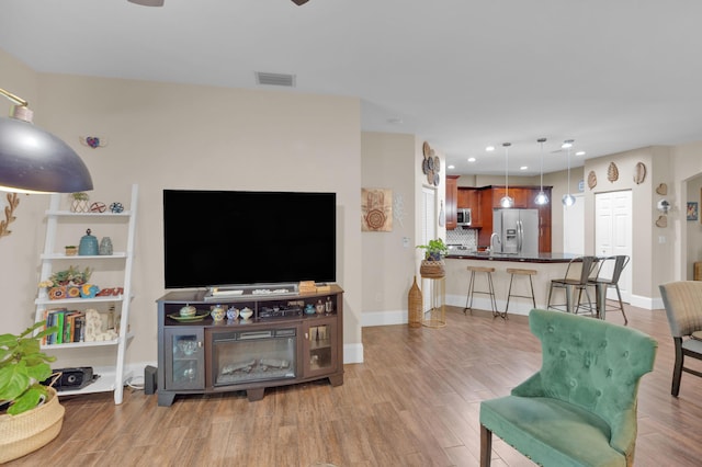 living room with light hardwood / wood-style floors