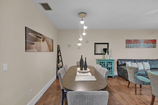 dining area featuring wood-type flooring