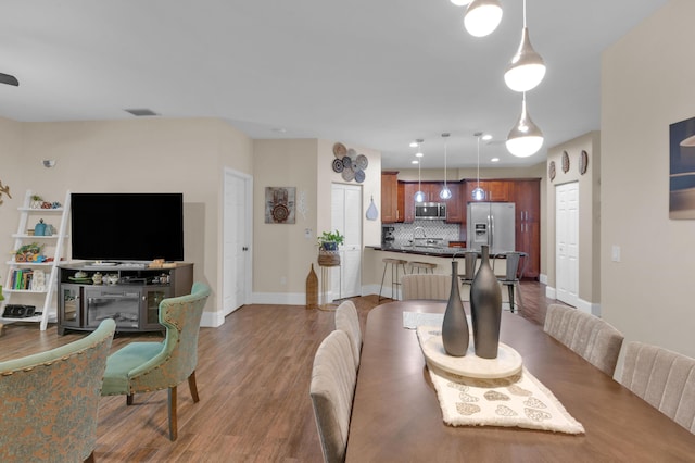 dining room featuring wood-type flooring