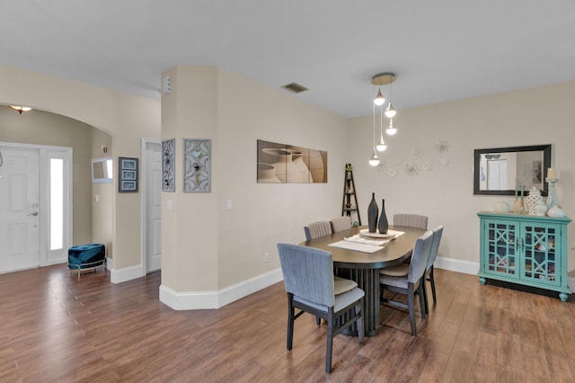 dining room with dark hardwood / wood-style flooring