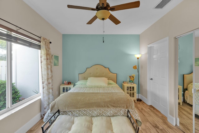 bedroom featuring light hardwood / wood-style floors and ceiling fan