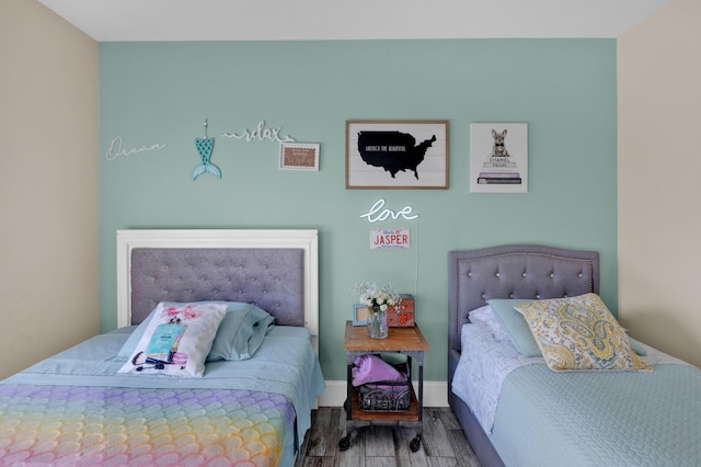 bedroom with wood-type flooring