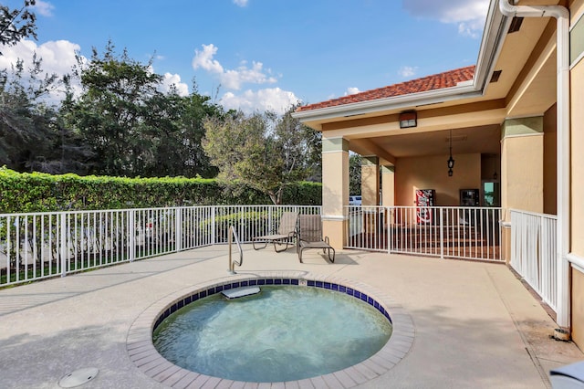 view of swimming pool featuring a patio area and a community hot tub