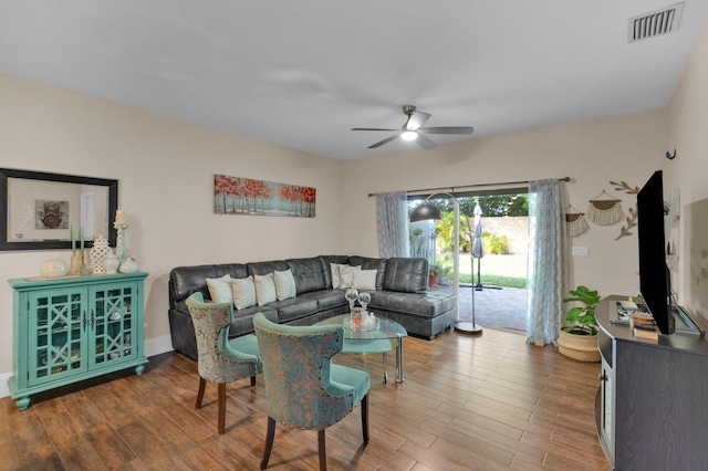 living room featuring hardwood / wood-style flooring and ceiling fan