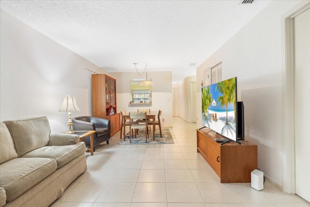 tiled living room with a textured ceiling