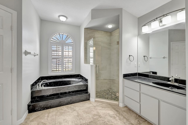 bathroom with separate shower and tub and vanity