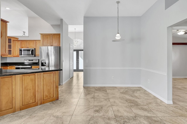 kitchen featuring ceiling fan, french doors, pendant lighting, light tile patterned flooring, and appliances with stainless steel finishes