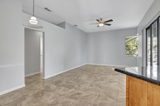 unfurnished room with ceiling fan