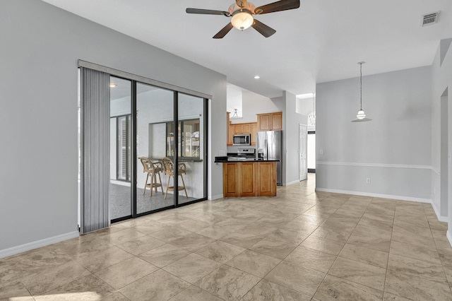 unfurnished living room featuring ceiling fan