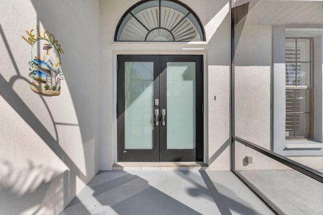 doorway to property featuring french doors