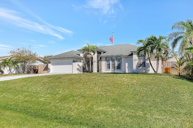 ranch-style house featuring a garage and a front lawn