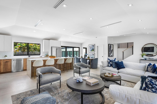 living room featuring vaulted ceiling