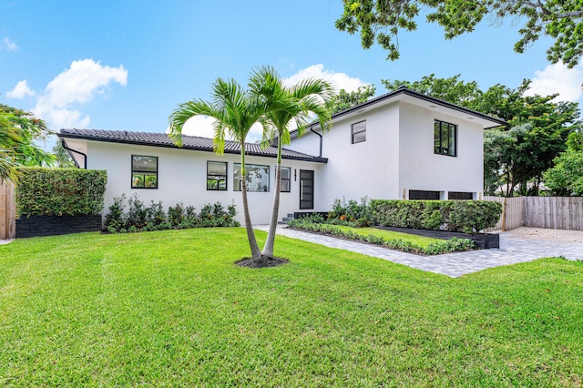 view of front of house with a front lawn