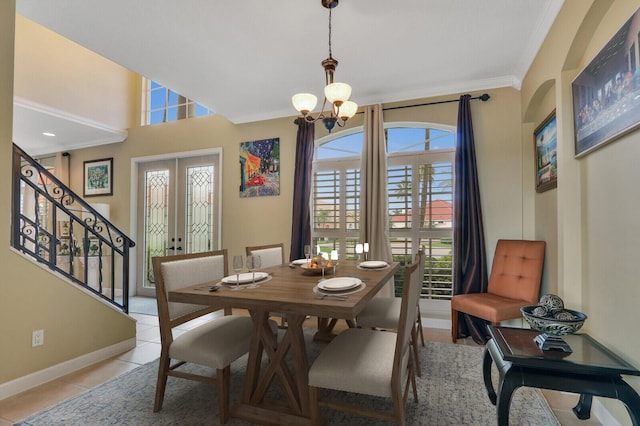 dining area with baseboards, stairway, french doors, a notable chandelier, and light tile patterned flooring