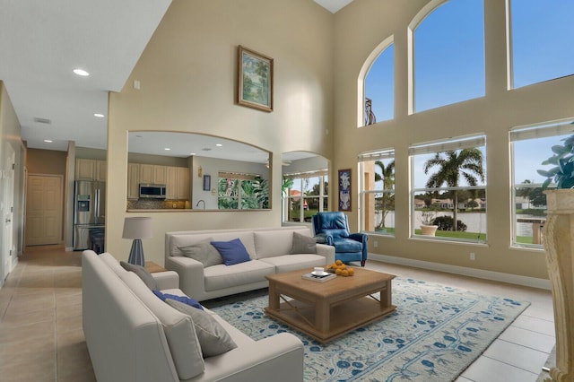 living room with recessed lighting, baseboards, and light tile patterned floors