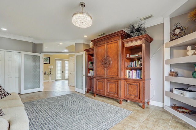 interior space with ornamental molding, french doors, and visible vents