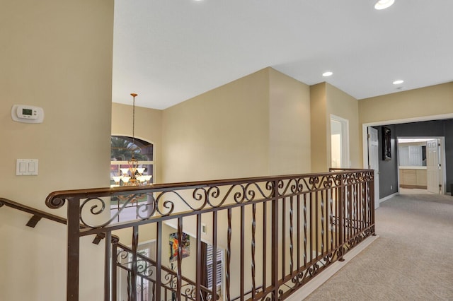 hallway with carpet floors, baseboards, and recessed lighting