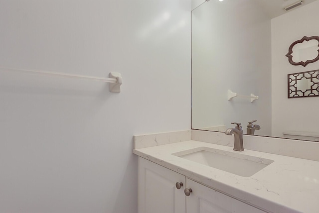 half bathroom with visible vents and vanity