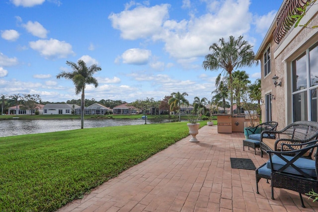 view of patio featuring a water view and a residential view