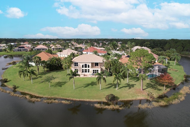 drone / aerial view featuring a water view and a residential view