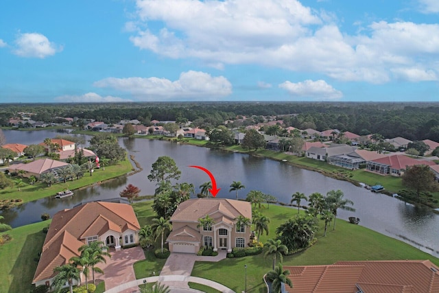 bird's eye view featuring a water view and a residential view