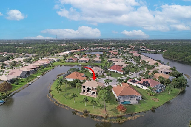 bird's eye view featuring a residential view and a water view