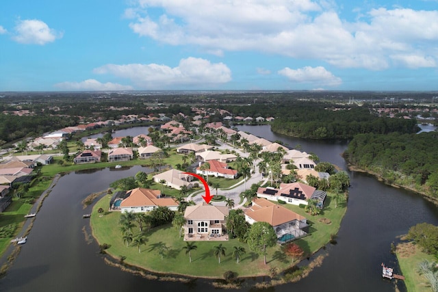 drone / aerial view featuring a water view and a residential view