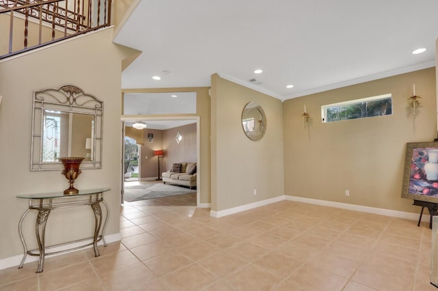 entrance foyer with light tile patterned floors, recessed lighting, visible vents, ornamental molding, and baseboards