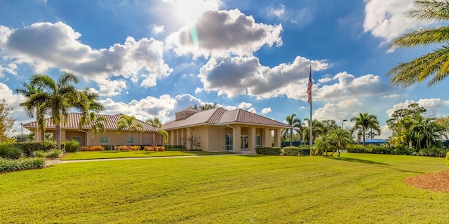 exterior space with a front yard and a tiled roof