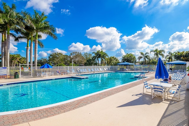 pool featuring a patio and fence